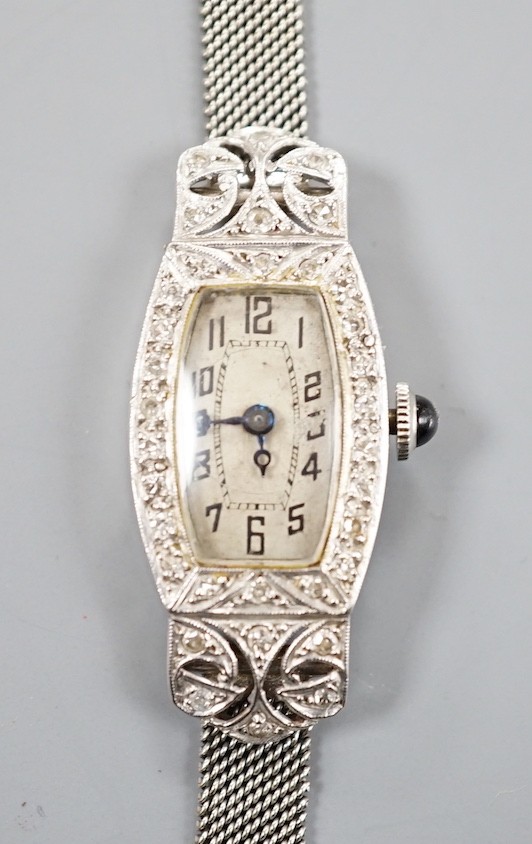 A lady's white metal (stamped plat) and diamond set cocktail watch, on a 9ct mesh link bracelet, overall 18cm, gross weight 17 grams.